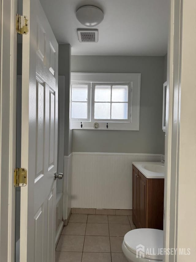 86 Harvey St, New Brunswick, NJ 08901 - bathroom with a wainscoted wall, tile patterned floors, and vanity