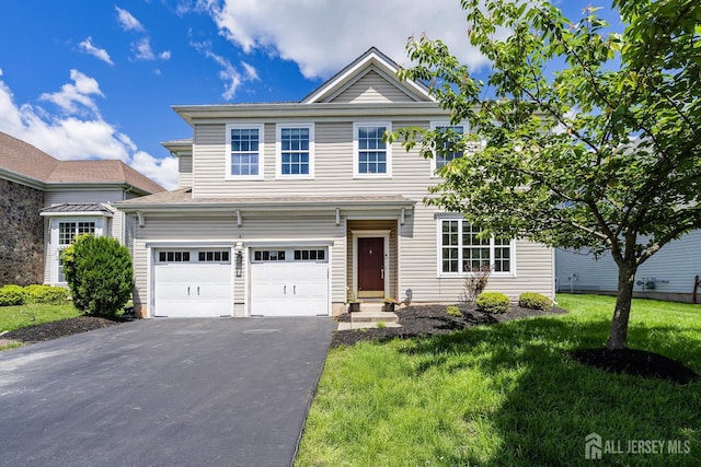 3 Lily Ln, Piscataway, NJ 08854 - traditional-style home with asphalt driveway, a front yard, and a garage