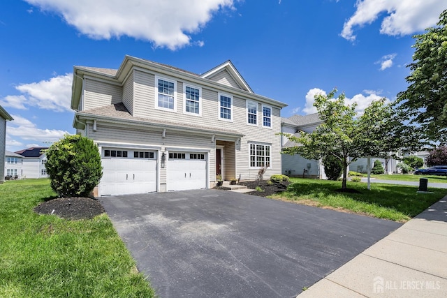 3 Lily Ln, Piscataway, NJ 08854 - view of front of house featuring an attached garage, asphalt driveway, and a front lawn