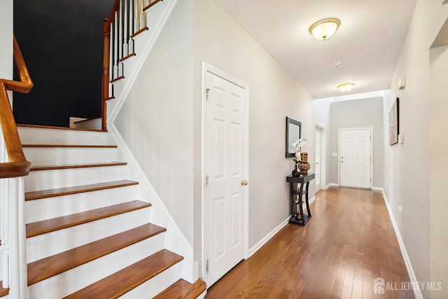 3 Lily Ln, Piscataway, NJ 08854 - stairs featuring wood finished floors and baseboards