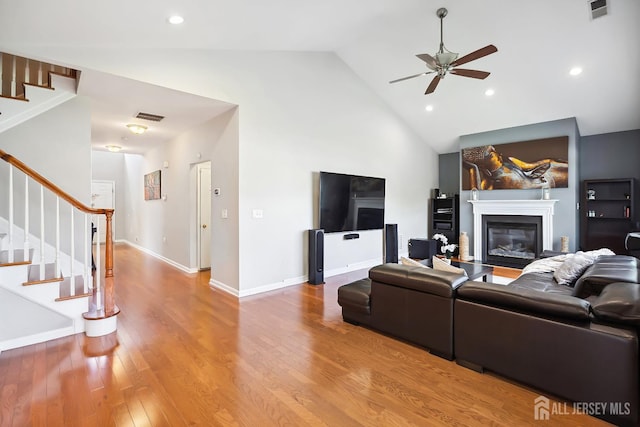3 Lily Ln, Piscataway, NJ 08854 - living room with ceiling fan, stairs, high vaulted ceiling, wood finished floors, and a glass covered fireplace