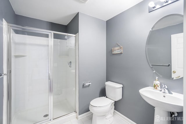 3 Lily Ln, Piscataway, NJ 08854 - bathroom with toilet, a shower stall, baseboards, tile patterned floors, and a sink