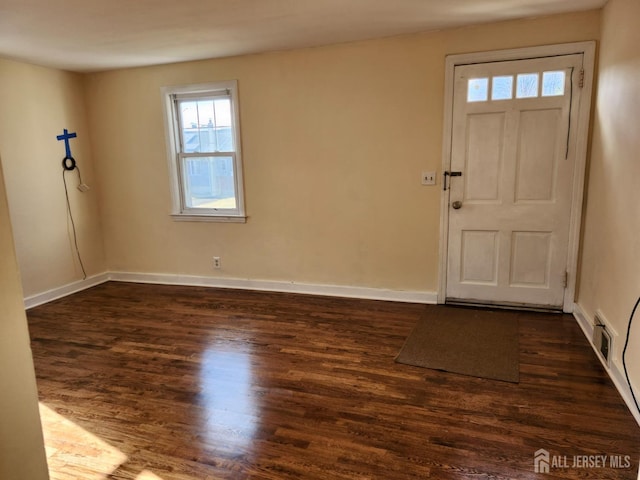 foyer entrance with dark wood-type flooring