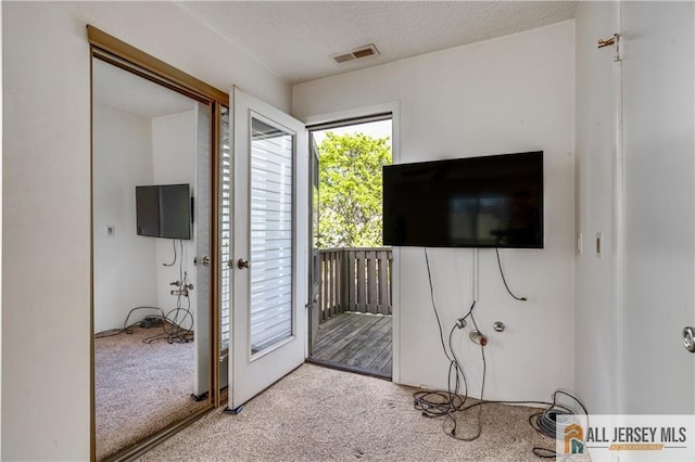 2302 Aspen Dr Unit 2302, Plainsboro, NJ 08536 - unfurnished bedroom featuring carpet floors, access to exterior, and a textured ceiling