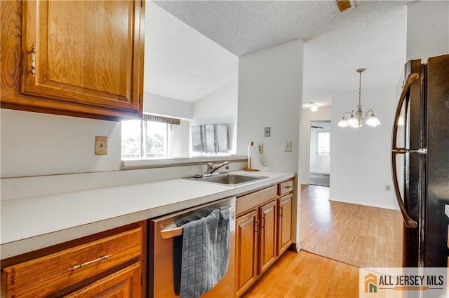 2302 Aspen Dr Unit 2302, Plainsboro, NJ 08536 - kitchen with stainless steel dishwasher, freestanding refrigerator, brown cabinetry, light wood-style flooring, and a sink