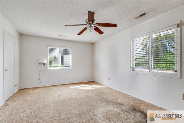 2302 Aspen Dr Unit 2302, Plainsboro, NJ 08536 - empty room with ceiling fan, carpet, and a textured ceiling
