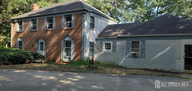 view of front of home featuring cooling unit