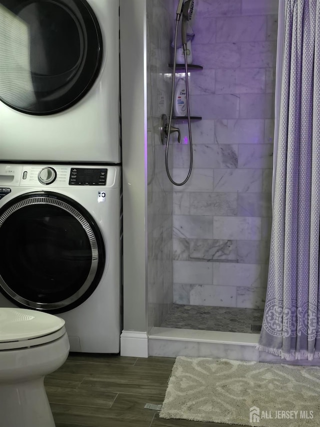 laundry room featuring stacked washer and dryer