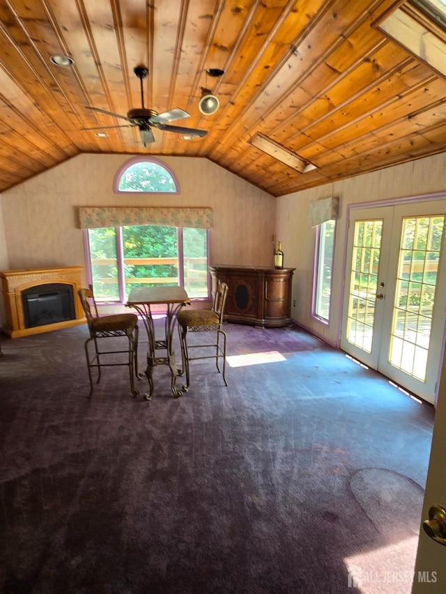 dining space with ceiling fan, wooden ceiling, carpet, and french doors