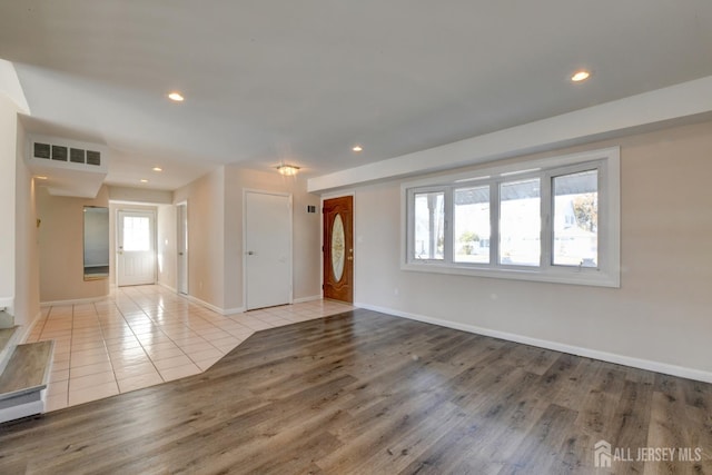 interior space with recessed lighting, visible vents, and tile patterned flooring