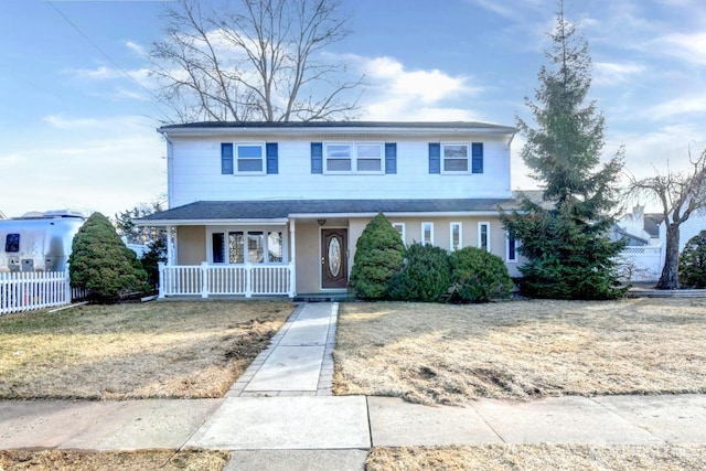 traditional home with covered porch and fence