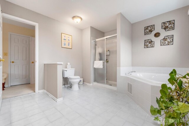 bathroom with separate shower and tub and toilet