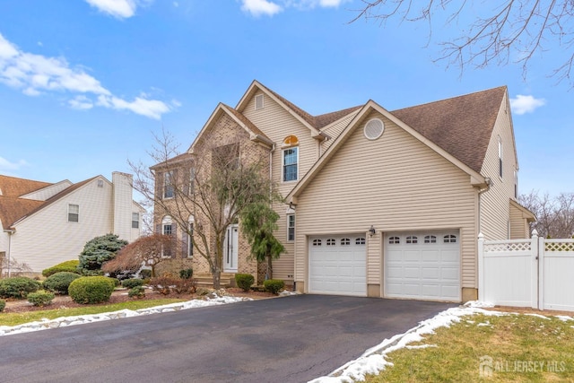 front facade with a garage