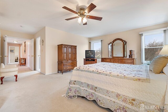 carpeted bedroom with ceiling fan