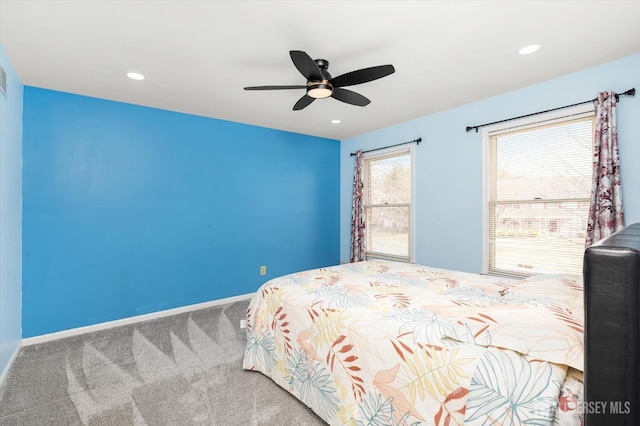 carpeted bedroom featuring recessed lighting, a ceiling fan, and baseboards