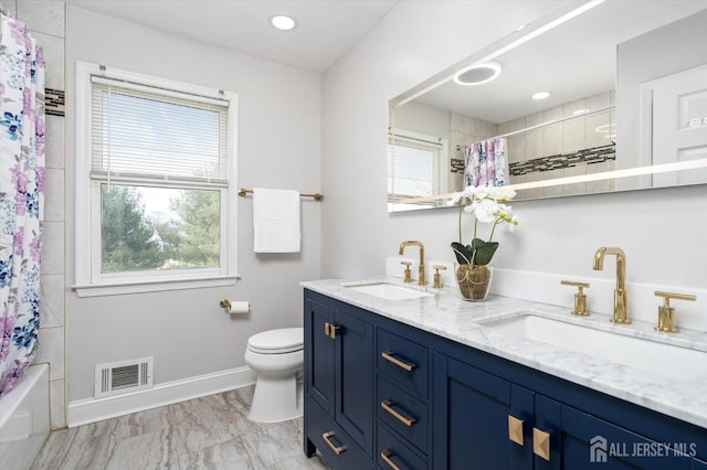 full bath featuring toilet, baseboards, visible vents, and a sink