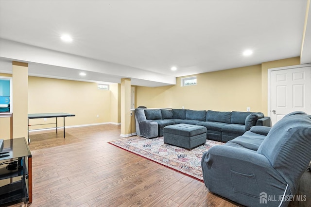 living area with recessed lighting, baseboards, and wood finished floors