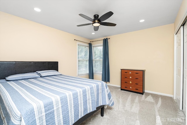 bedroom with carpet flooring, recessed lighting, baseboards, and a closet