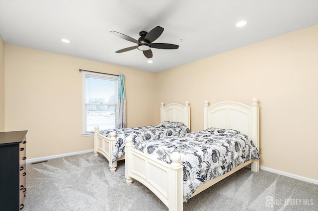 bedroom with light carpet, recessed lighting, a ceiling fan, and baseboards