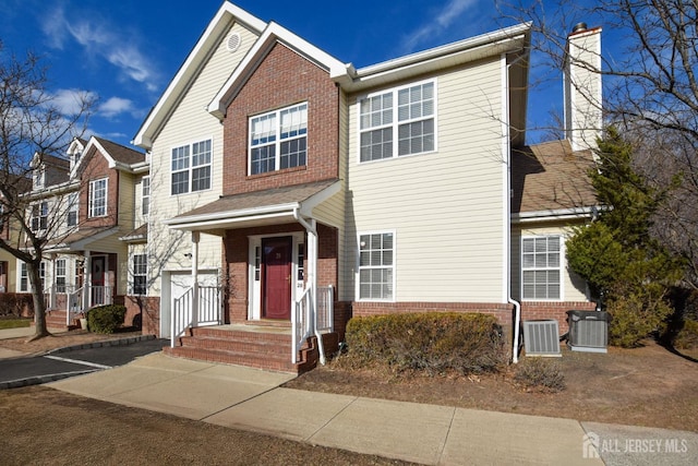 multi unit property with central air condition unit and brick siding