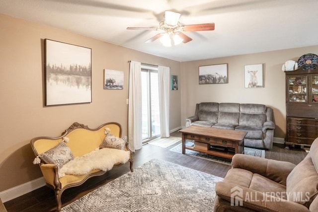 living room with hardwood / wood-style flooring and ceiling fan