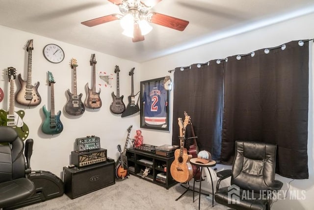 interior space featuring light carpet and ceiling fan