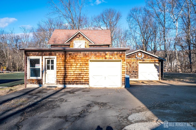 exterior space with aphalt driveway