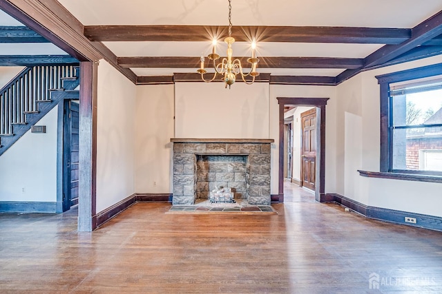404 Mountainview Ter, Dunellen, NJ 08812 - unfurnished living room featuring a chandelier, wood finished floors, beamed ceiling, stairway, and baseboards