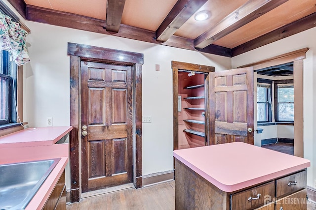 404 Mountainview Ter, Dunellen, NJ 08812 - office area with beam ceiling, light wood finished floors, a sink, and baseboards