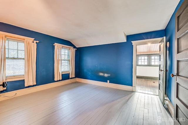404 Mountainview Ter, Dunellen, NJ 08812 - empty room with hardwood / wood-style floors, baseboards, and vaulted ceiling