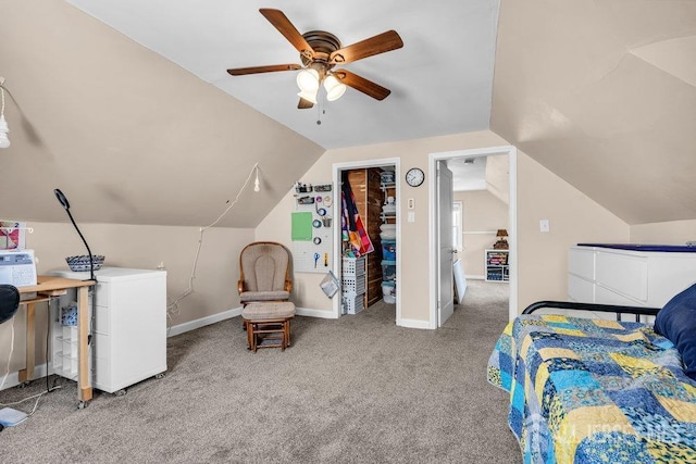 carpeted bedroom with fridge, baseboards, ceiling fan, and vaulted ceiling