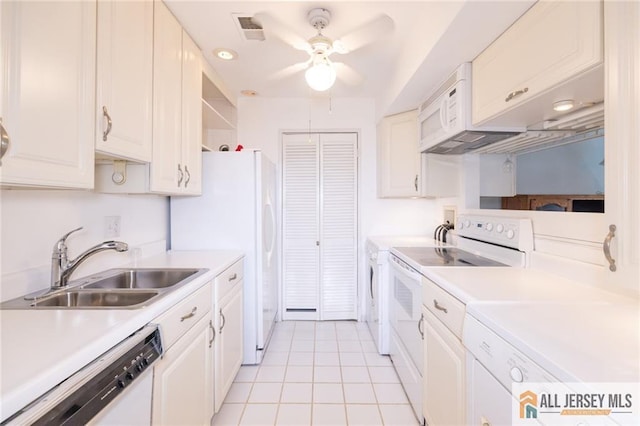 50 Prospect St Unit 09, Metuchen, NJ 08840 - kitchen featuring white appliances, ceiling fan, light countertops, washer and clothes dryer, and light tile patterned floors
