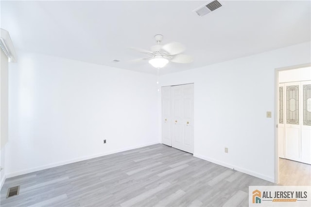 50 Prospect St Unit 09, Metuchen, NJ 08840 - unfurnished bedroom with light wood finished floors, a closet, and a ceiling fan