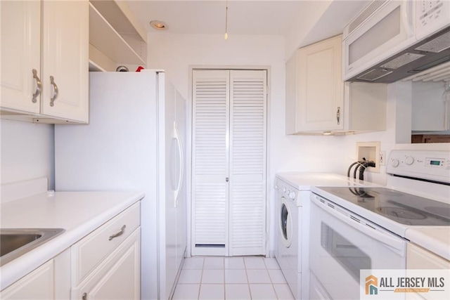 50 Prospect St Unit 09, Metuchen, NJ 08840 - kitchen with white appliances, light countertops, light tile patterned flooring, and white cabinets