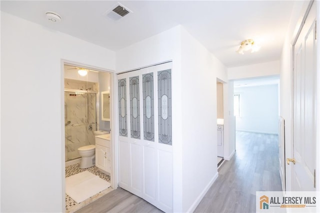 50 Prospect St Unit 09, Metuchen, NJ 08840 - corridor with light wood-style floors and baseboards