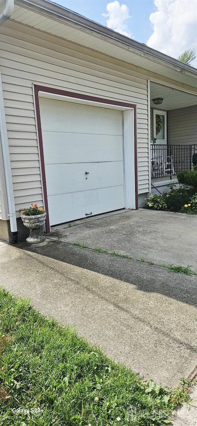 789 Barry Ave, Perth Amboy, NJ 08861 - garage with asphalt driveway and covered porch