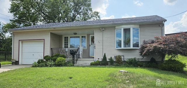 789 Barry Ave, Perth Amboy, NJ 08861 - view of front facade with a garage, a porch, a front lawn, and concrete driveway
