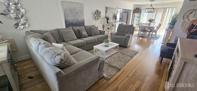 789 Barry Ave, Perth Amboy, NJ 08861 - living area featuring wood finished floors and baseboards