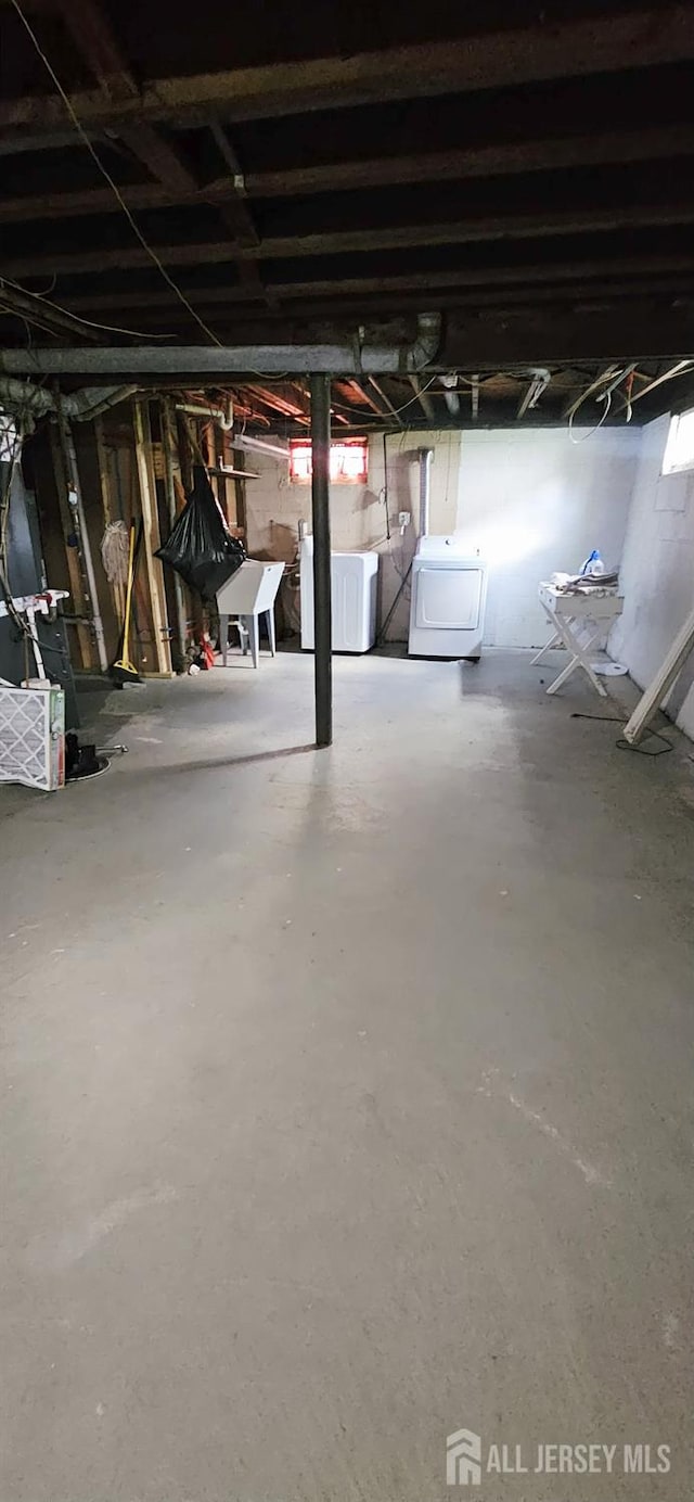 789 Barry Ave, Perth Amboy, NJ 08861 - unfinished below grade area with washing machine and dryer