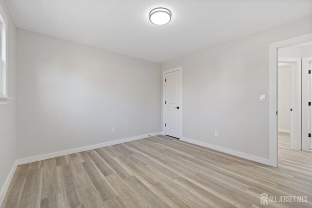 spare room with light hardwood / wood-style floors