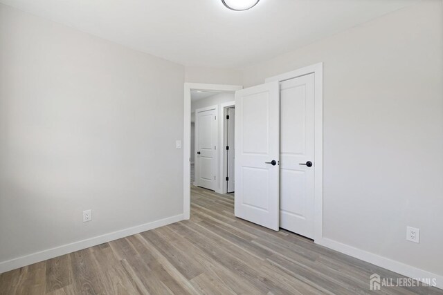 unfurnished bedroom with light hardwood / wood-style floors