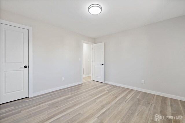 empty room with light wood-type flooring