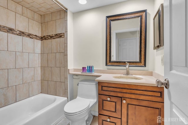 bathroom with shower / bathtub combination, toilet, and vanity