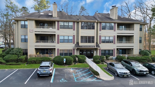 view of property featuring uncovered parking