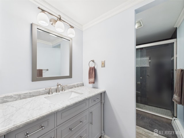 full bathroom featuring visible vents, baseboard heating, a shower stall, vanity, and ornamental molding