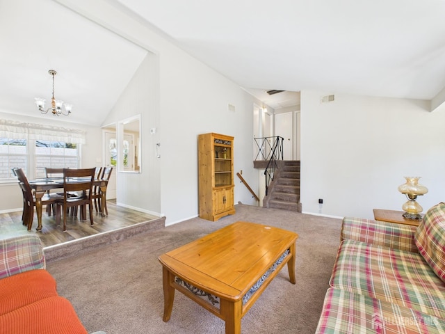 carpeted living area with stairs, baseboards, a chandelier, and lofted ceiling