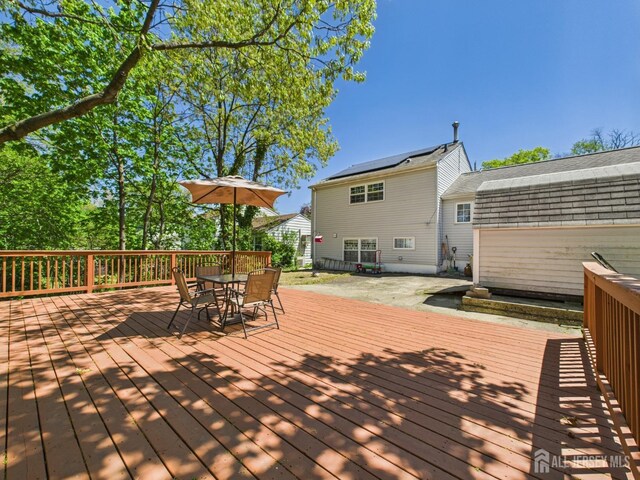 wooden deck with outdoor dining space
