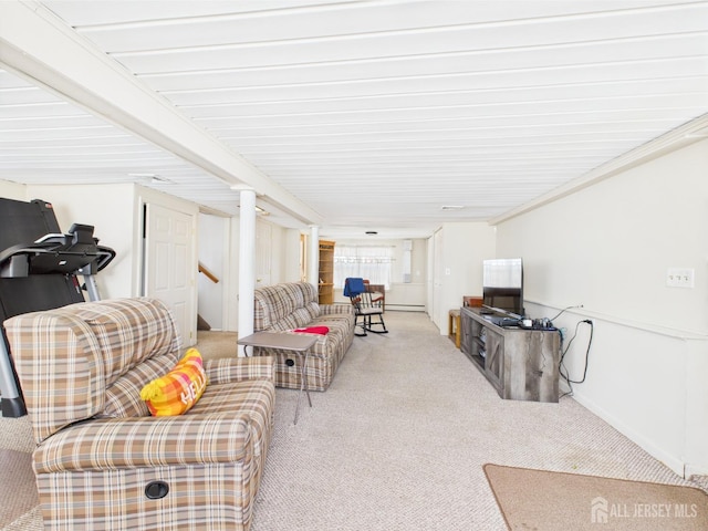 living room featuring carpet floors and baseboards