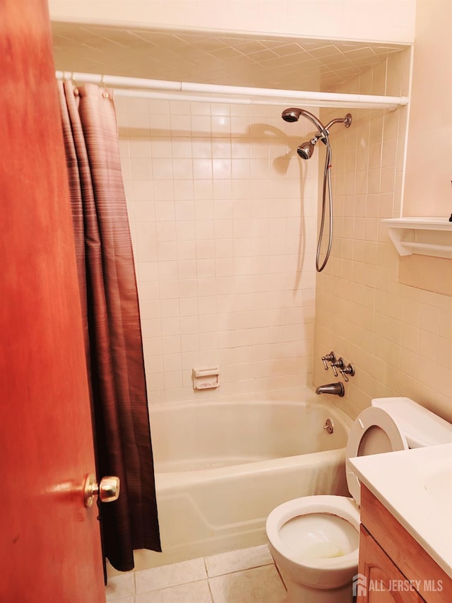 694 Vincent Pl, Perth Amboy, NJ 08861 - full bath featuring shower / bathtub combination with curtain, toilet, tile patterned floors, vanity, and tile walls