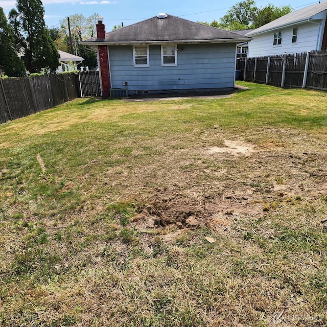 694 Vincent Pl, Perth Amboy, NJ 08861 - rear view of house with a chimney and cooling unit